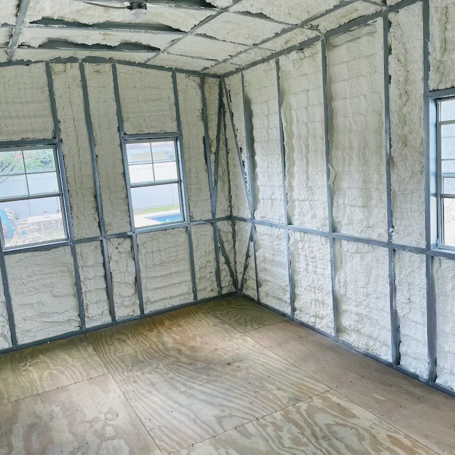 Closed-cell spray foam insulation applied to wall cavities in a residential project in Merrimack
